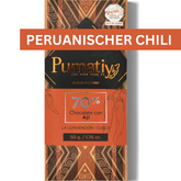 Verpackung der 70% Bitterschokolade mit peruanischem Chili von Pumatiy mit rotem und braunem Muster. Text: '70% Chocolate con Ají', 'La Convención - Cusco', '50 g / 1.76 oz'. Oben rechts steht 'PERUANISCHER CHILI' und ein Aufkleber zeigt die Auszeichnung der Peru Chocolate Awards 2022.